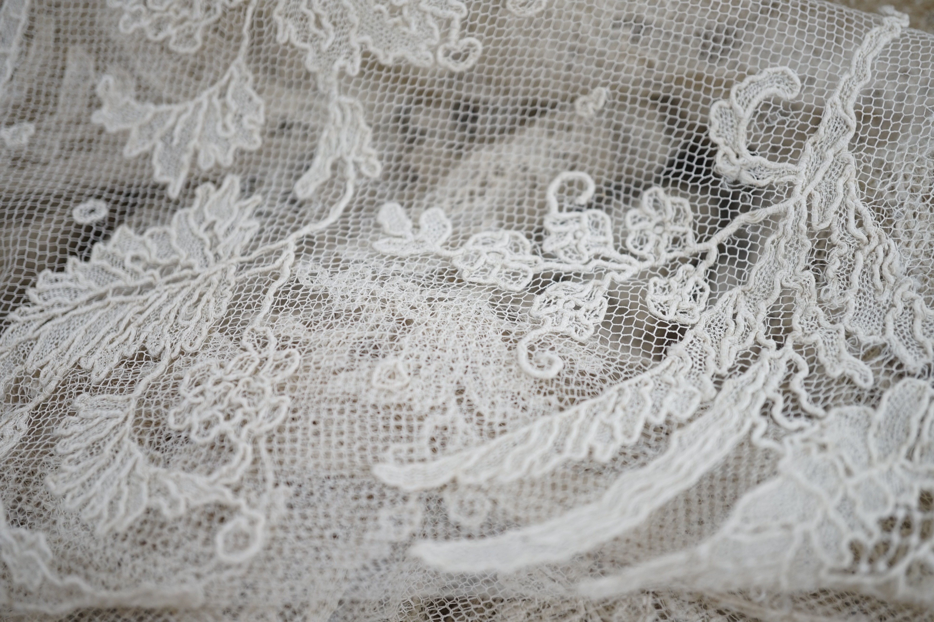 A rare length (9 and a half yards) of Brussels 19th century needle lace, some repairs and damage, circa 1880 and a similar wedding veil